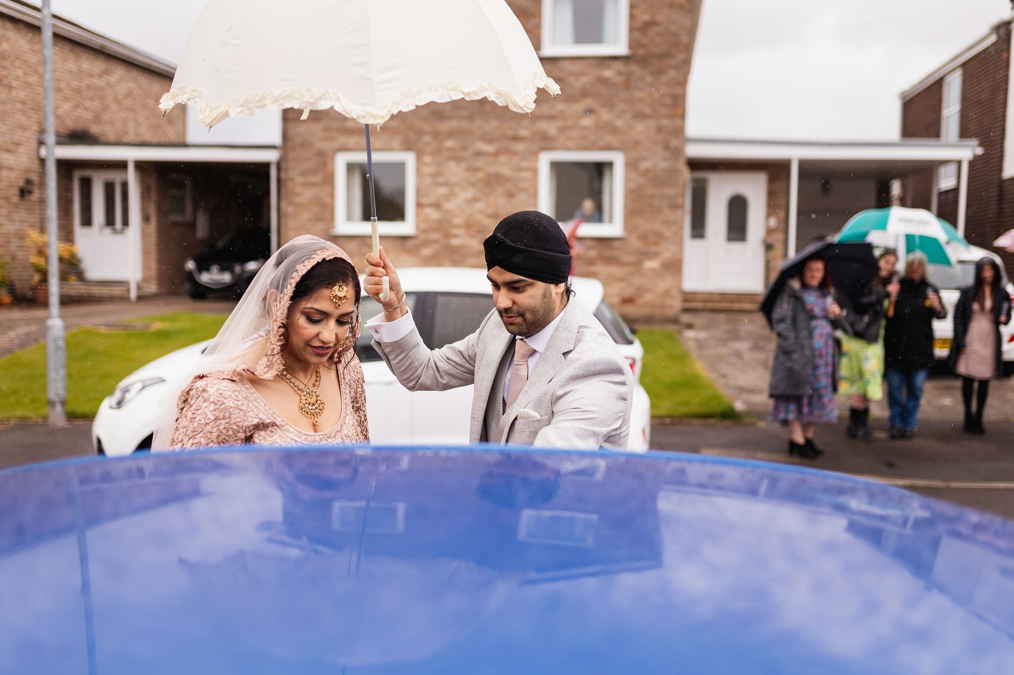 Sikh wedding photographer, Cardiff, Wales, bride leaving house