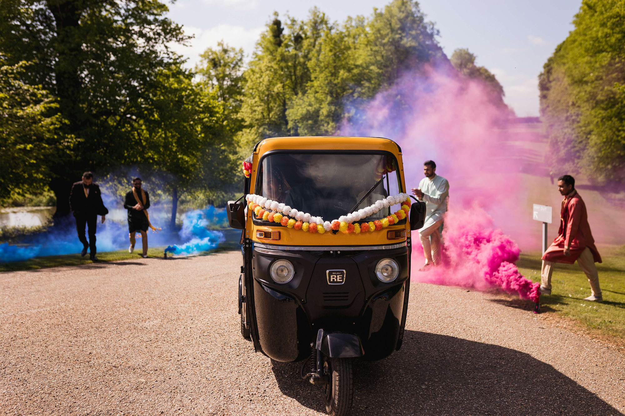Asian Wedding Photographer in Essex, Braxted Park, Couples entrance, smoke grenades, rickshaw