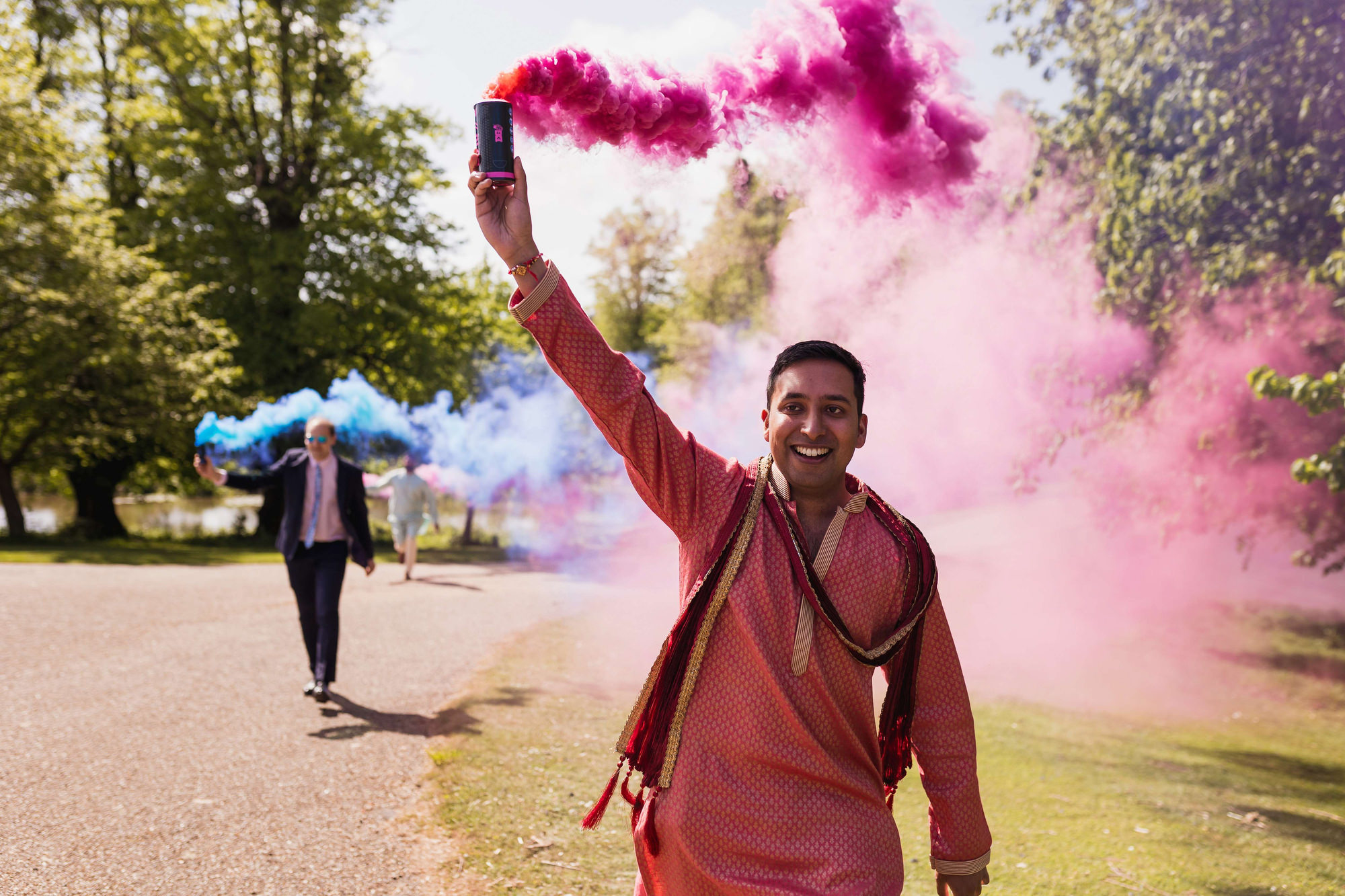 Asian Wedding Photographer in Essex, Braxted Park, Couples entrance, smoke grenades